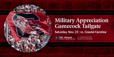 A vibrant image of a large South Carolina Gamecocks flag waving amid a cheering crowd at a football game, with text overlay announcing the Military Appreciation Gamecock Tailgate on Saturday, Nov. 22, against Coastal Carolina, in collaboration with the USC Alumni and Veterans Alumni Council.